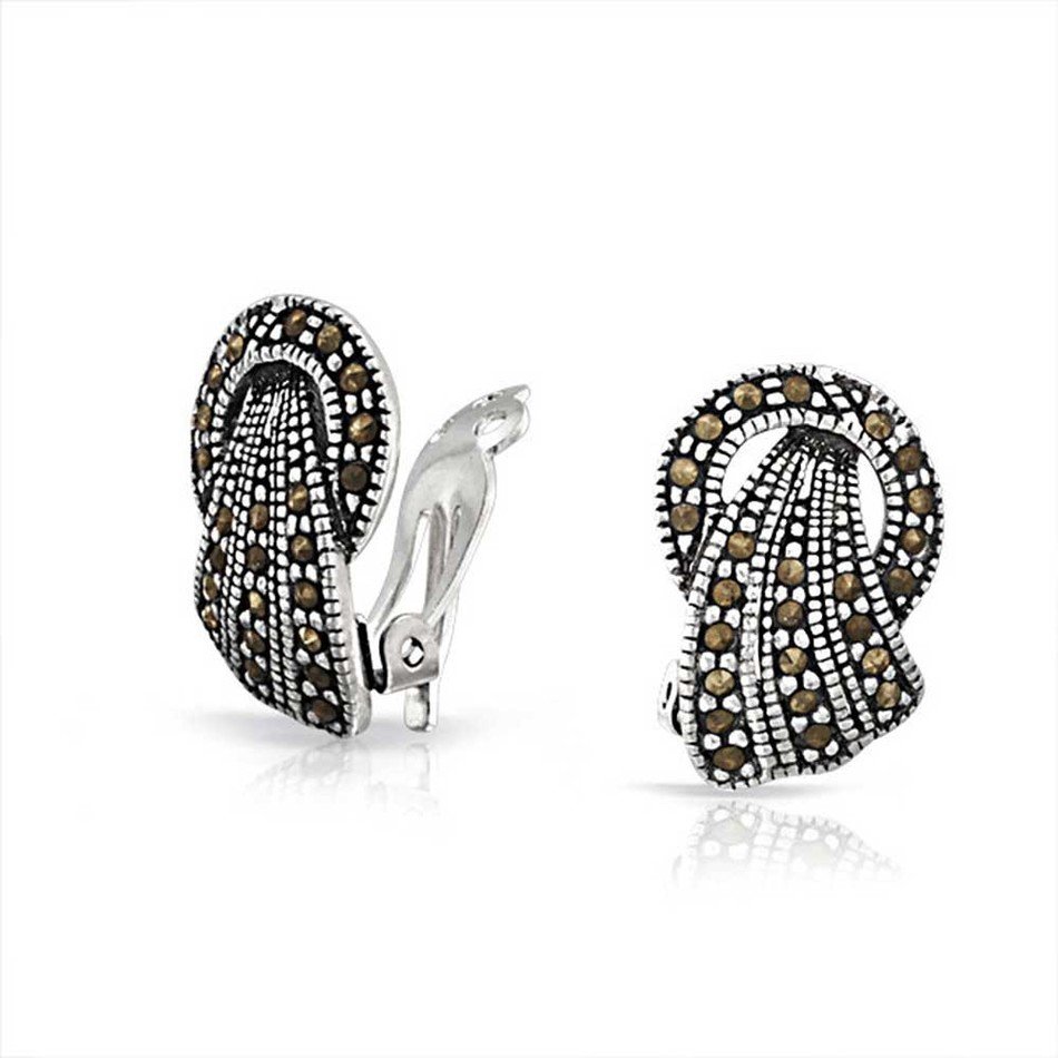 photo of beautiful silver earrings with stones