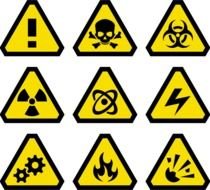 warning signs on a black background