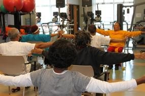 people in yoga pose in the hall