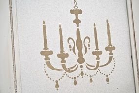 painted retro chandelier on the wallpaper