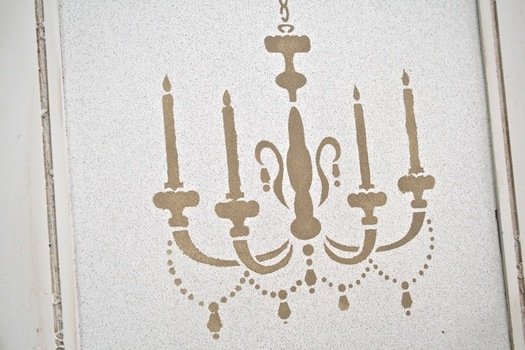 painted retro chandelier on the wallpaper