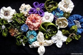fabric flowers on the black background
