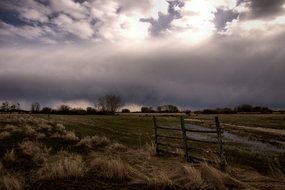farmland beneath stormy Clouds at evening