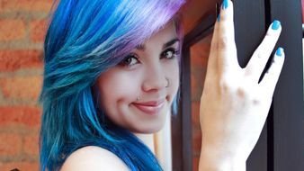 photo of a girl with blue hair and blue manicure