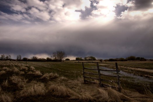 farmland beneath stormy Clouds at evening