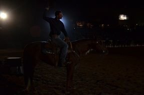 victorious silhouette of a man on a horse