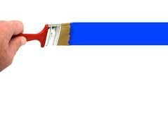 brush in hands and blue paint