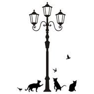 painted street lamp and black cats