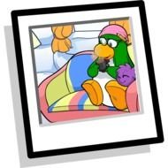 photo of cartoon penguin on an armchair