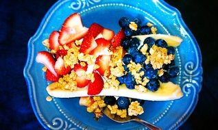 organic muesli with blueberries and strawberries