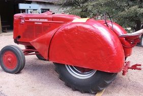 Vintage red tractor on a farm