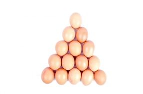 chicken eggs in the shape of a triangle