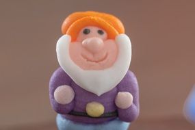 sweet decorative element in the form of a dwarf