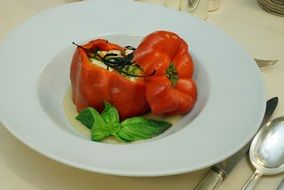 stuffed red pepper on a plate in a restaurant