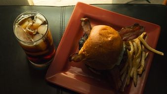 incredibly tasty burger fries and whiskey