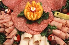 sliced meat, salami and turkey ham on dish