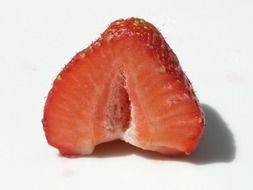 Half of strawberry on a white background