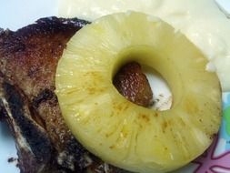 delicious fried pineapple with a piece of fried meat as dish