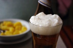 potatoes and a glass of foam beer