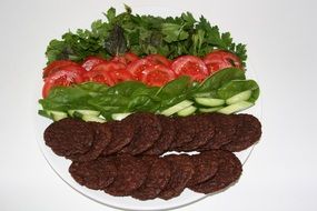 cutlets with vegetables on a large plate