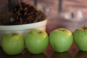 fresh and beautiful green apples close-up on blurred background