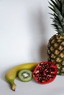 banana and raspberries and kiwi and pineapple