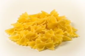 Italian Farfalle pasta on white surface