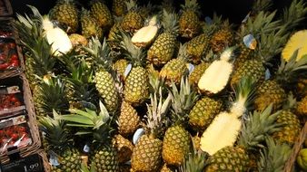 pile of pineapples in supermarket