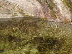 basin with clear water in rock close-up