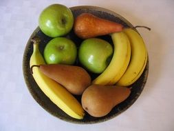 fruit plate apples, pears and bananas