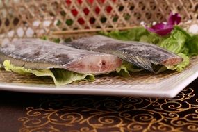 fresh ribbonfish on a plate