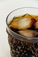 refreshing sparkling drink with cola and ice