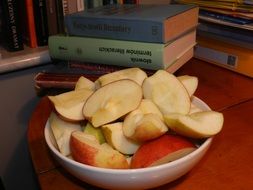 sliced apple in a white plate