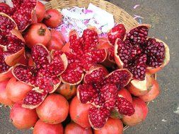 variety of pomegranates in a large basket