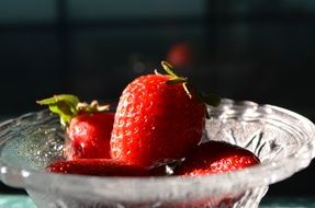 ripe strawberries in a glass bowl