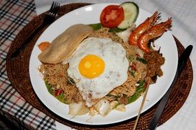 Mie goreng with fried egg and prawns