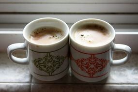 Mugs full with hot coffee