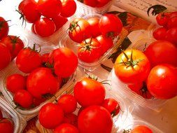 red tomatoes in wicker baskets