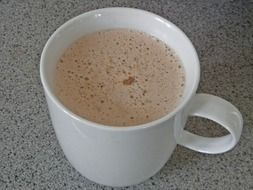 cappuccino in a white cup on the table