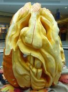 ugly male face, pumpkin carved for halloween