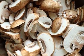 sliced mushrooms lie in a pile
