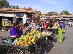 people selling papaya on fruit market, india