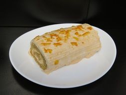 cake roll on a white plate