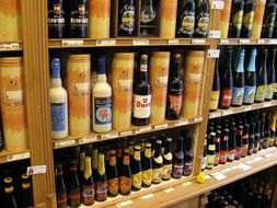 bottles with alcohol drinks on shelves