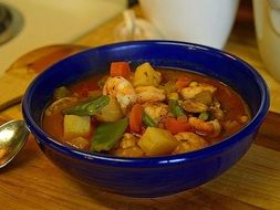 seafood soup in a blue plate