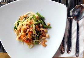 Healthy asian salad with papaya in Thailand