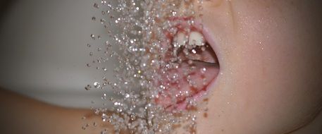 drops of water in front of mouth