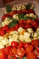 mozzarella cheese and tomatoes lie in a pile