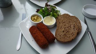 slices of bread on a plate with food