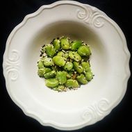 seeds and green beans in a plate
